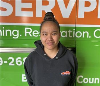 Employee in front of the SERVPRO truck