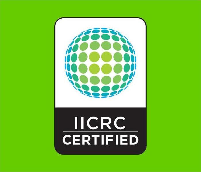 Green background with the IICRC logo which looks like a sphere with lines that give it dimension.